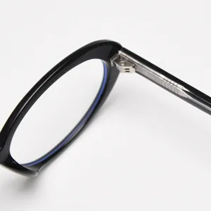 Korean style retro small oval optical glasses frame detail shot, black frame with metal hinge.