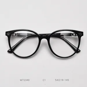 Large round optical eyeglass frames for men and women, black acetate frame with silver cross decor.