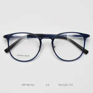 Close-up detail of Korean retro round blue eyeglass frame, plastic-steel optical glasses.