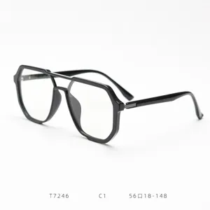 Vue détaillée de la monture de lunettes rétro à double pont noir au design octogonal.