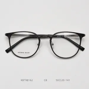 Detailed close-up view of vintage round optical glasses frame, showing model and size.