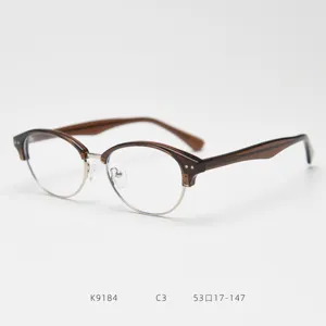 Dettaglio della montatura per occhiali vintage semi-rimless in acetato marrone e metallo, K9184.