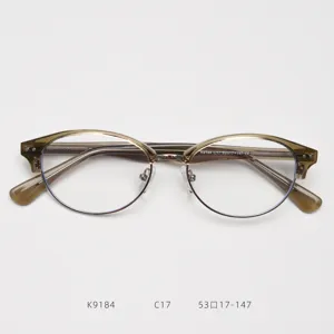 Vista dettagliata della montatura per occhiali retro semi-rimless con sopracciglio in metallo.
