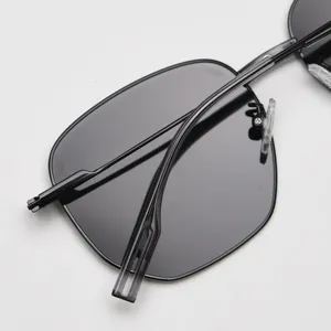 Black polygonal metal sunglasses detail view, trendy polarized sun eyewear for daily fashion wear.
