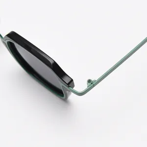 Detailed close-up shot of trendy geometric sunglasses showing exquisite metal hinge design.