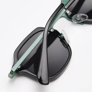 Trendy retro metal polarized sunglasses with stylish polygon frame and green sparkle temples.