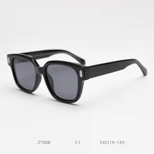 Close-up detail of black acetate square frame sunglasses, polarized lenses, stylish daily wear.