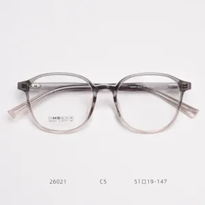 Detailed view of the gradient greyish-pink TR90 optical eyeglass frame, lightweight.