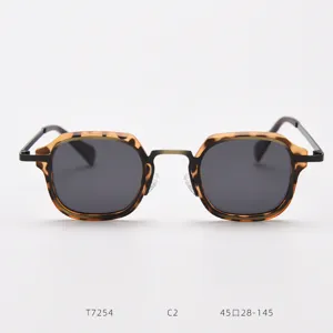 Detail view of retro tortoise shell metal sunglasses, showcasing vintage geometric frame design.