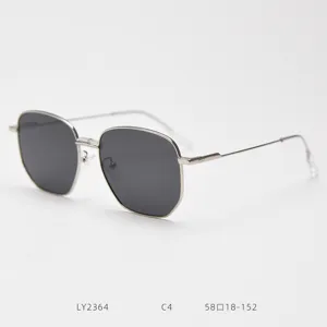 Detailed view of metal polygon sunglasses frame, stylish vintage design with dark lenses.