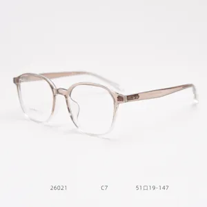Transparent brown TR90 eyeglasses frame detail view, stylish lightweight optical glasses side close-up.