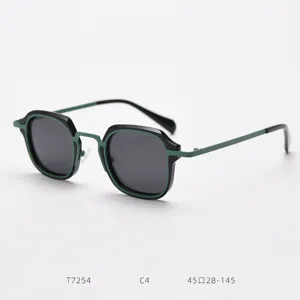 Detailed retro small square sunglasses featuring black green metal frames for trendy street snap.