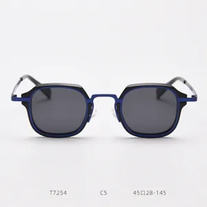 Detailed view of vintage metal sunglasses with black and blue frames, stylish eyewear design.