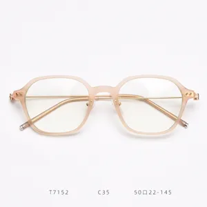 Detail view of stylish TR90 thin optical glasses frame with delicate gold metal bridge.