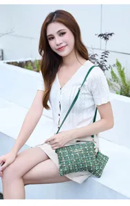 Green tweed crossbody cosmetic bag with strap and compact design for daily women use