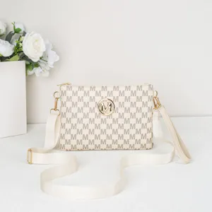 Womens monogram crossbody bag with chic metallic logo and adjustable strap for daily use.