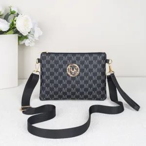 Detailed view of black monogram crossbody bag with zipper closure and adjustable shoulder strap.