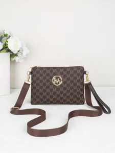 Women brown monogram crossbody bag with gold tone hardware and adjustable strap for daily use.