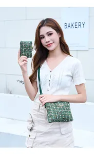 Detailed view of the green tweed cosmetic bag, showcasing fine texture and exquisite hardware.