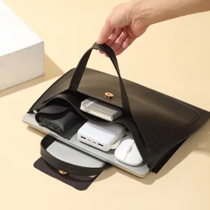 Detail view of the black leather laptop bag interior capacity, showcasing organized compartments.