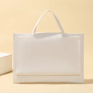 Minimalist white tote bag detail, large capacity leather business handbag for laptop daily use.