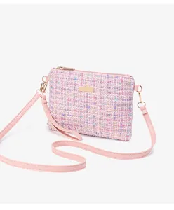 Pink tweed crossbody bag detail view, stylish miniature shoulder handbag with strap.