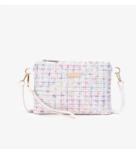 Detail view of the colorful tweed crossbody bag showcasing texture and gold hardware.