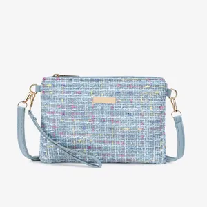 Light blue tweed crossbody bag for women, chic woven shoulder handbag with gold hardware.