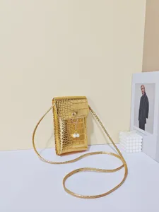 Gouden krokodillenpatroon telefoon tasje detail, mini lederen tasje met parel.