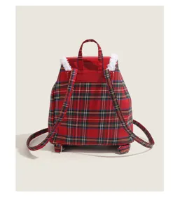 Red plaid backpack back view detail with white faux shearling trim and adjustable shoulder straps.