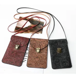 Borsa a tracolla per telefono con motivo floreale goffrato vintage e serratura metallica.