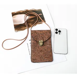 Borsa a tracolla per telefono in pelle goffrata floreale vintage con fibbia in metallo.