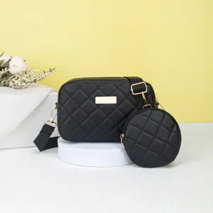 Black quilted crossbody bag with round coin purse and gold tone hardware for women