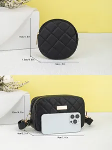 Black quilted crossbody camera bag and round coin purse set with gold tone hardware.