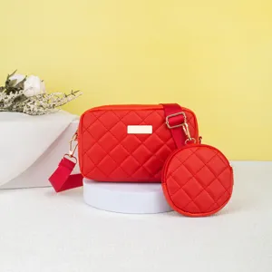 Red quilted crossbody camera bag with round coin purse, stylish shoulder handbag for women.