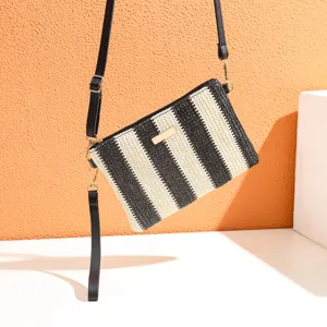 Black and white striped straw crossbody bag, stylish casual woven shoulder bag for women.
