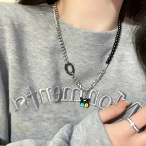 Detailed shot of sweet and cool black cat pendant clavicle chain with asymmetric design.
