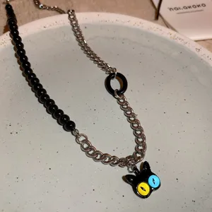 Cute cartoon cat pendant necklace with black beads and metal chain for sweet dark style fashion.