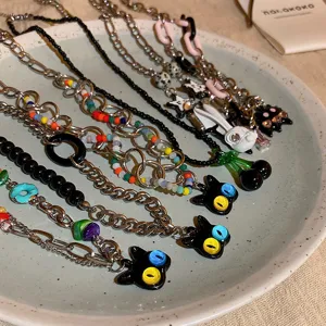 Sweet and cool style black cat and cherry necklace set, edgy collarbone chain detail view.