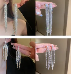 Sparkling rhinestone fringe tassel earrings detail shot showing brilliant crystal shine and craft.