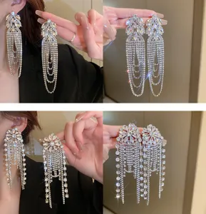 Exquisite rhinestone long tassel earrings detail view, sparkling crystal dangle jewelry.