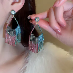 Exquisite close-up detail showcasing the sparkling colorful rhinestone fringe earrings.