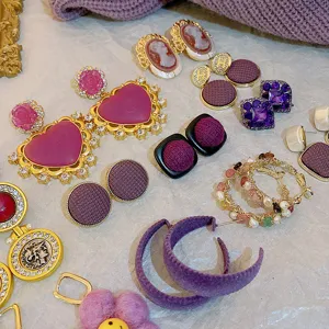 French vintage purple earrings set featuring unique heart, fabric, and pearl designs.