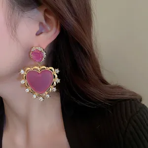 French vintage purple rhinestone heart earrings, exquisite gold metal drop design detail.