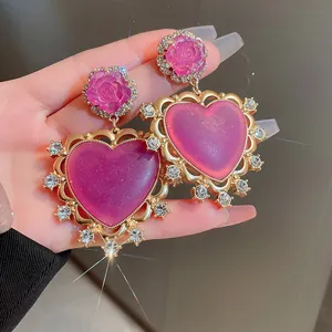 French vintage style purple rhinestone heart rose earrings detail closeup luxury fashion jewelry.
