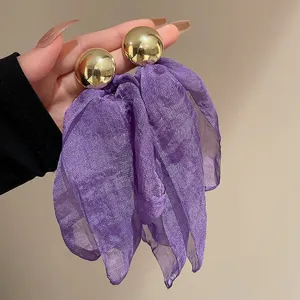 Elegant purple fabric dangling earrings with smooth gold metal balls for stylish women.