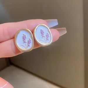 French vintage purple lavender flower oval stud earrings delicate detail macro display shot