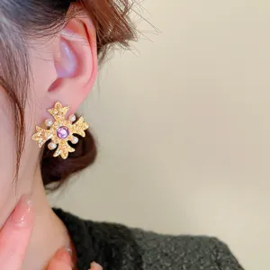 French vintage style purple gem cross ear studs with delicate pearls detail for women.