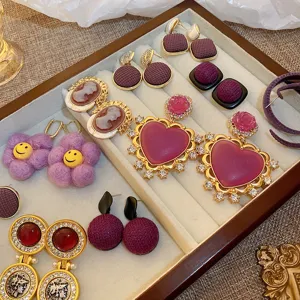 French vintage retro purple rhinestone flower heart cameo earrings tray detail display set.