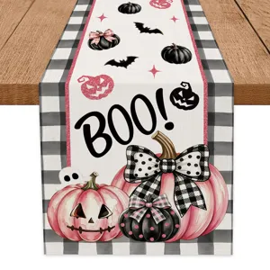 Halloween table runner with pink black pumpkin and ghost print for festive dining decor.